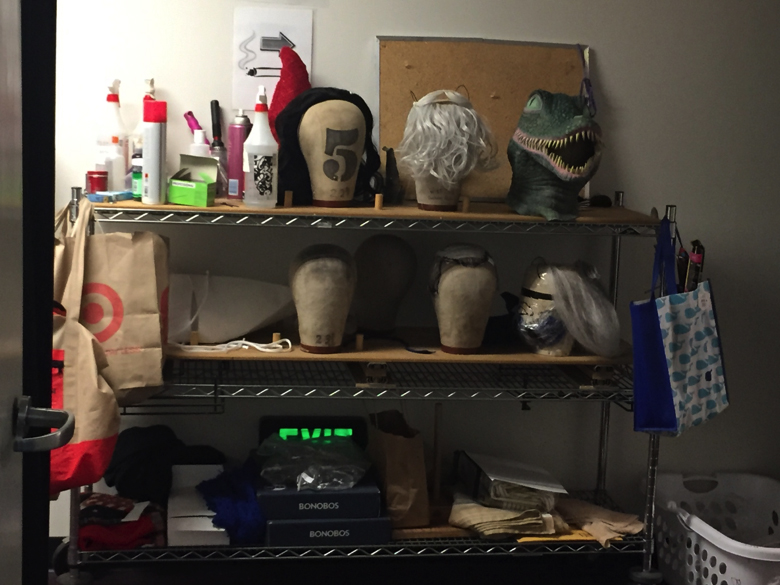 The slightly less glamorous wig rack complete with lizard head.