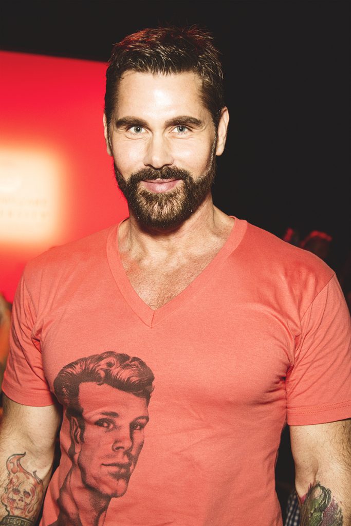 Pictured is Jack Mackenroth, a model and a fashion designer who competed in the fourth season of Project Runway. Image Source: Danielle Rueda