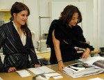 Nathalie Rykiel (right) looks at the work by BFA Fashion and Knitwear major Jannika Lilja.